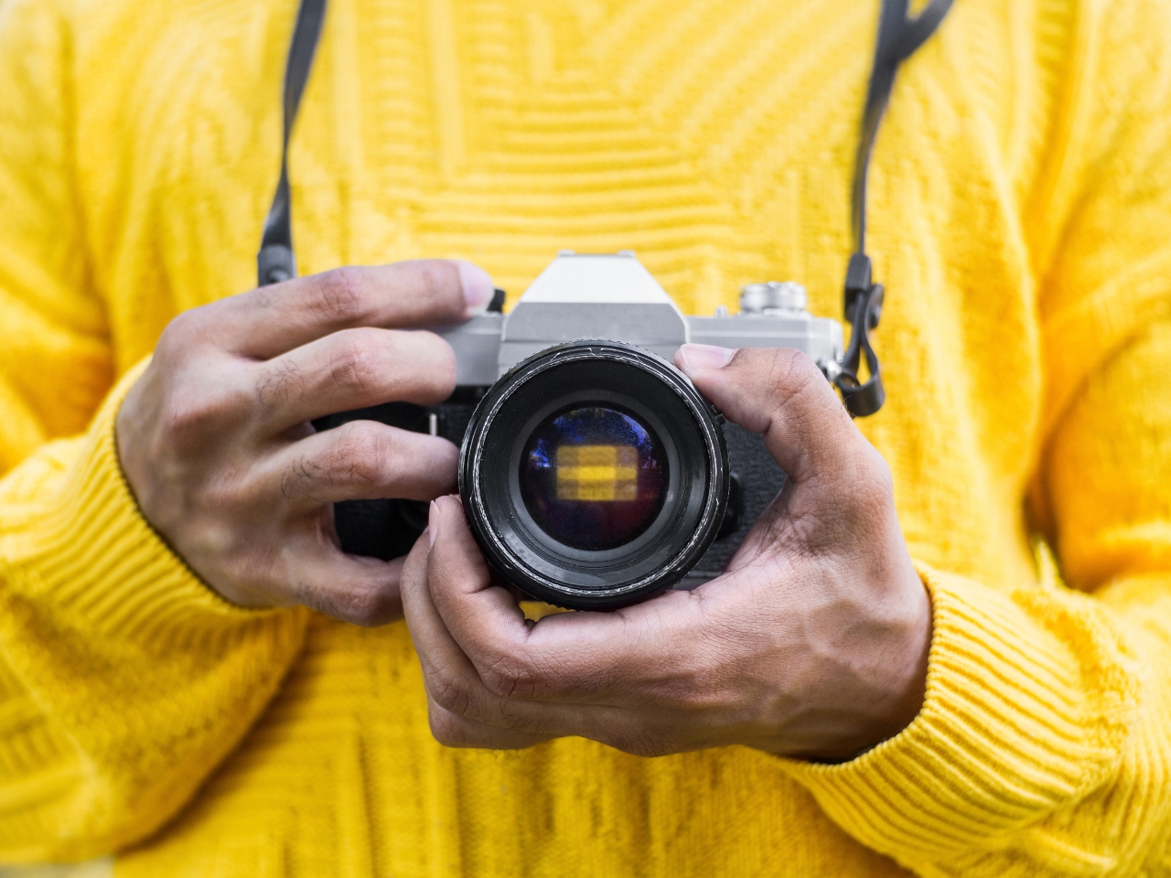 Photographer holding a vintage camera