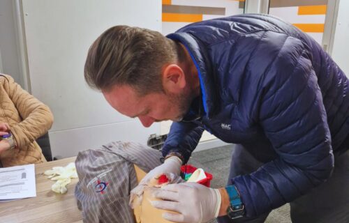 Practicing First Aid on a dummy.