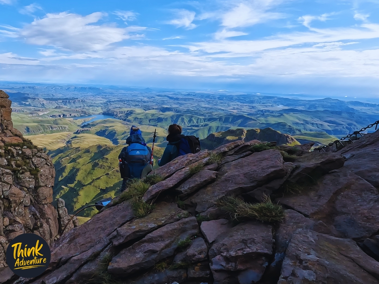 Two hikers on top of the chain ladders at the Tugela Falls hike