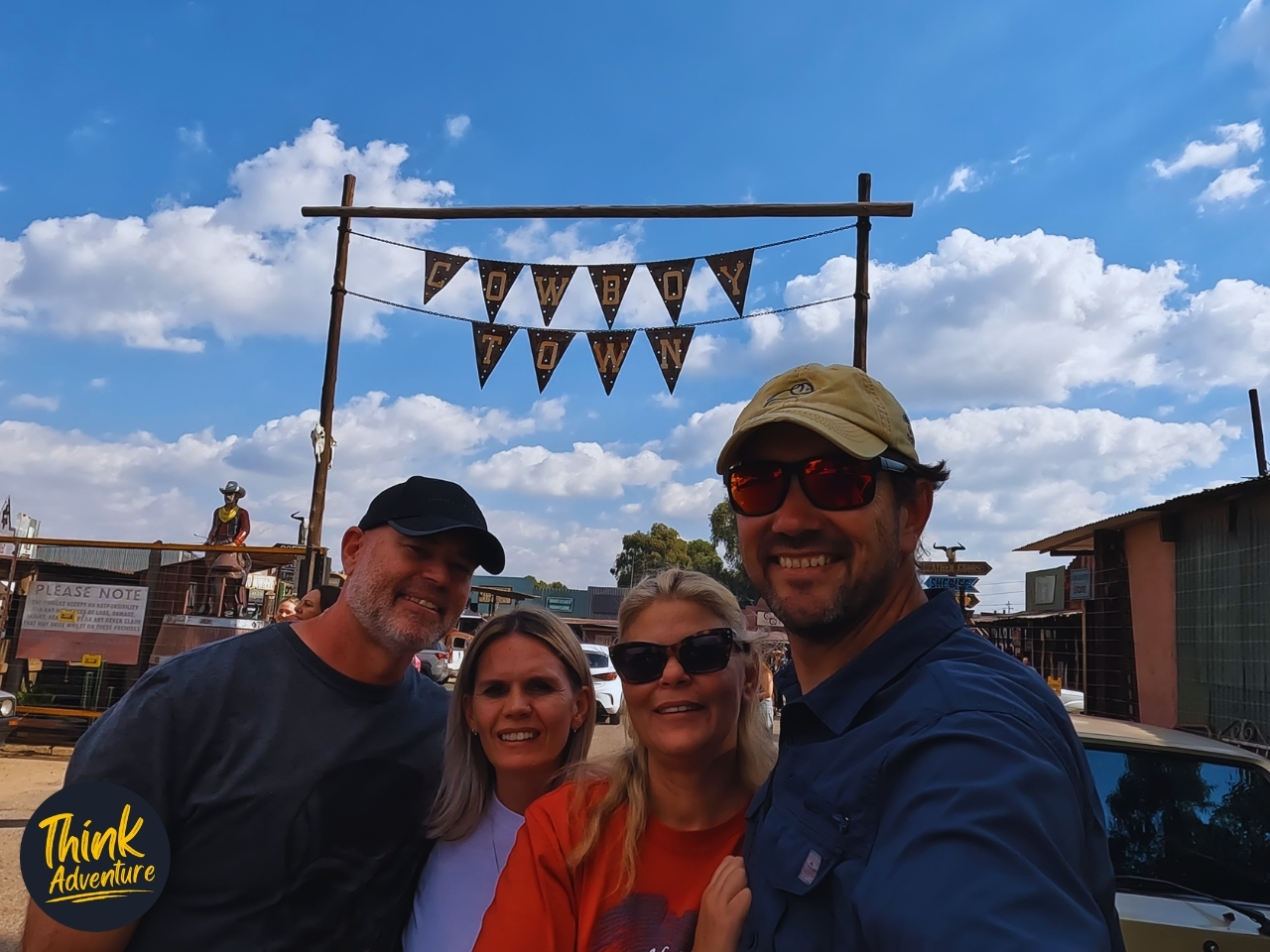 Group photo in front of Cowboy Town entrance.