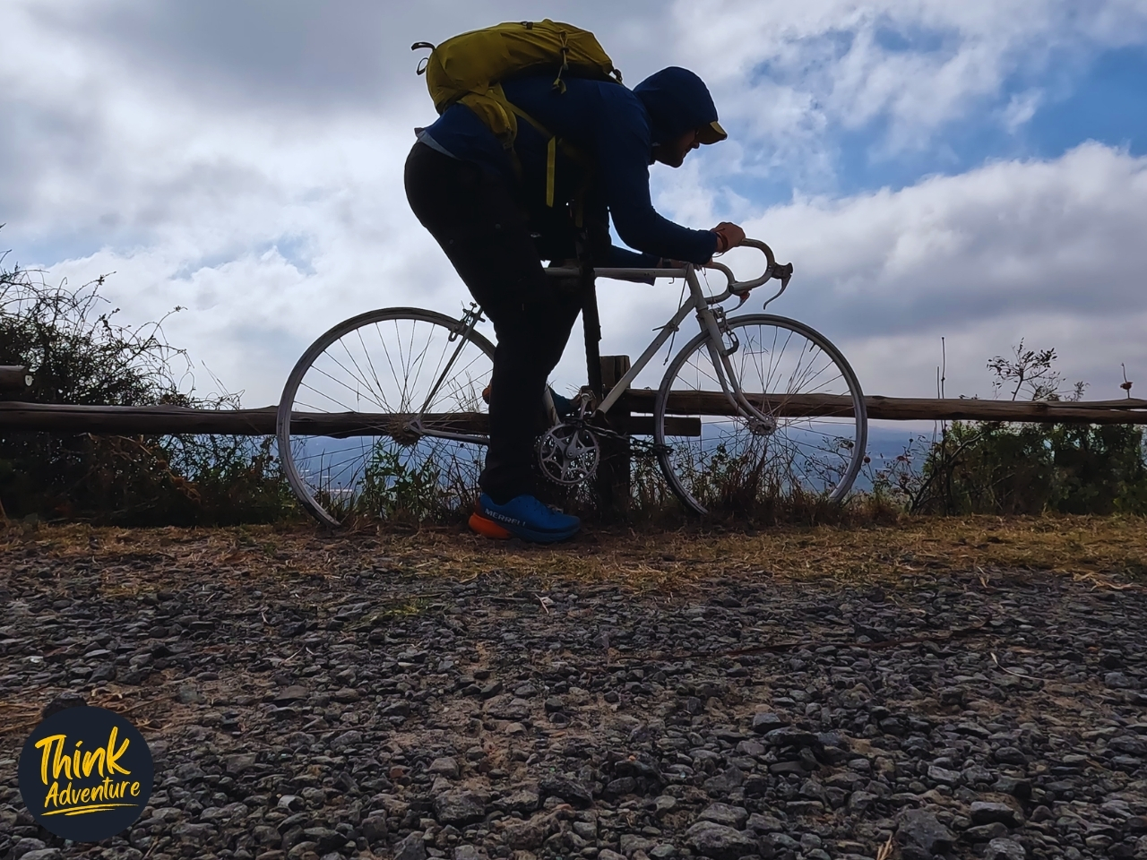A hiker on a bicycle on the Red Trail at the Klapperkop Nature Reserve