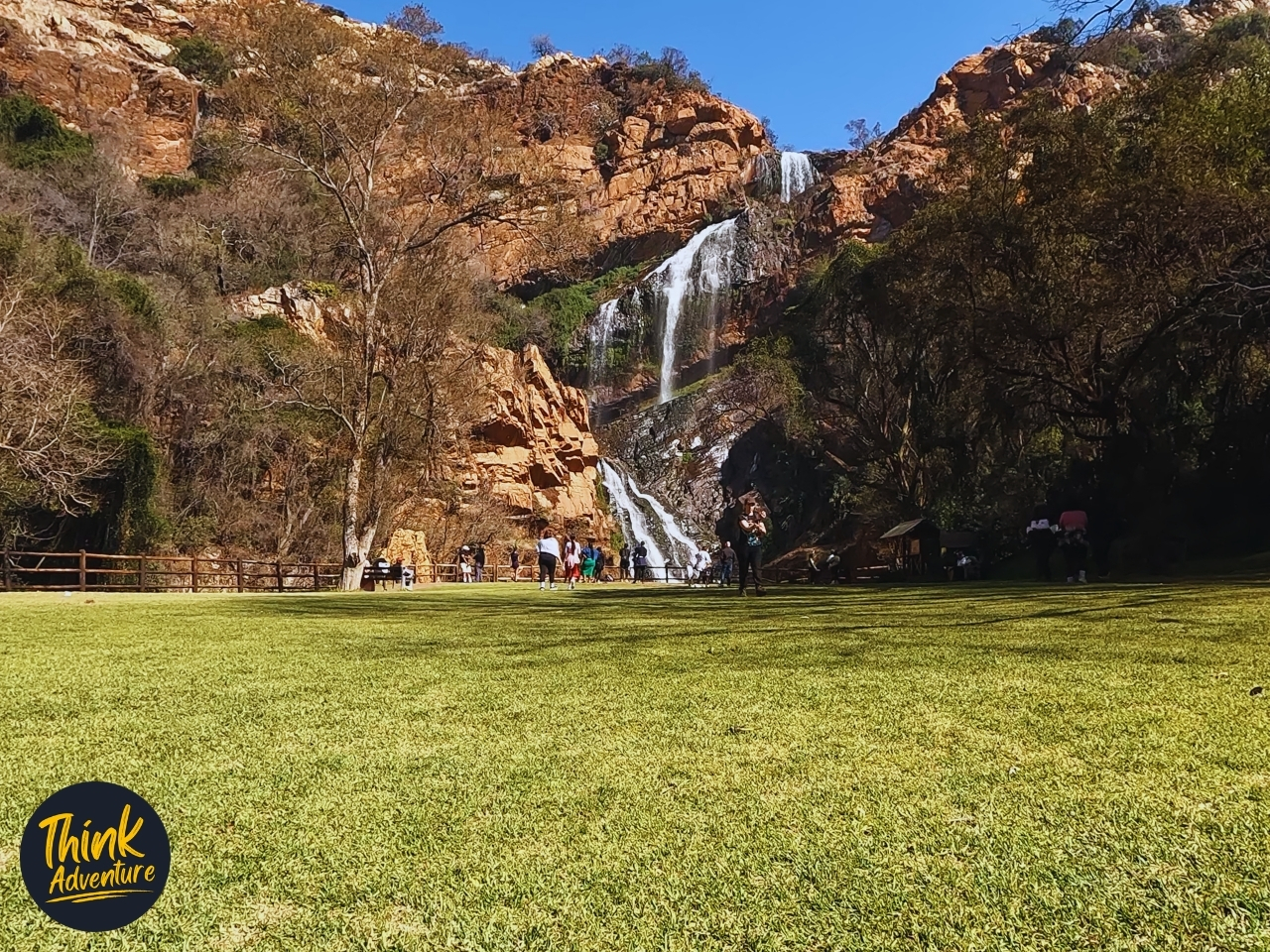 Across the lawn looking at Witpoortjie Falls at Walter Sisulu Garden